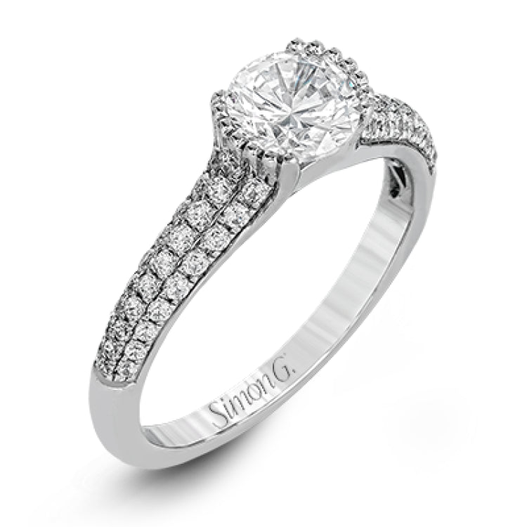 A modern take on a classic design, this white gold engagement ring is accented by .35 ctw of round cut white diamonds.