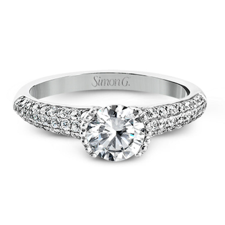 A modern take on a classic design, this white gold engagement ring is accented by .35 ctw of round cut white diamonds.