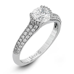 A modern take on a classic design, this white gold engagement ring is accented by .35 ctw of round cut white diamonds.