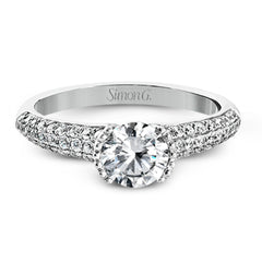 A modern take on a classic design, this white gold engagement ring is accented by .35 ctw of round cut white diamonds.