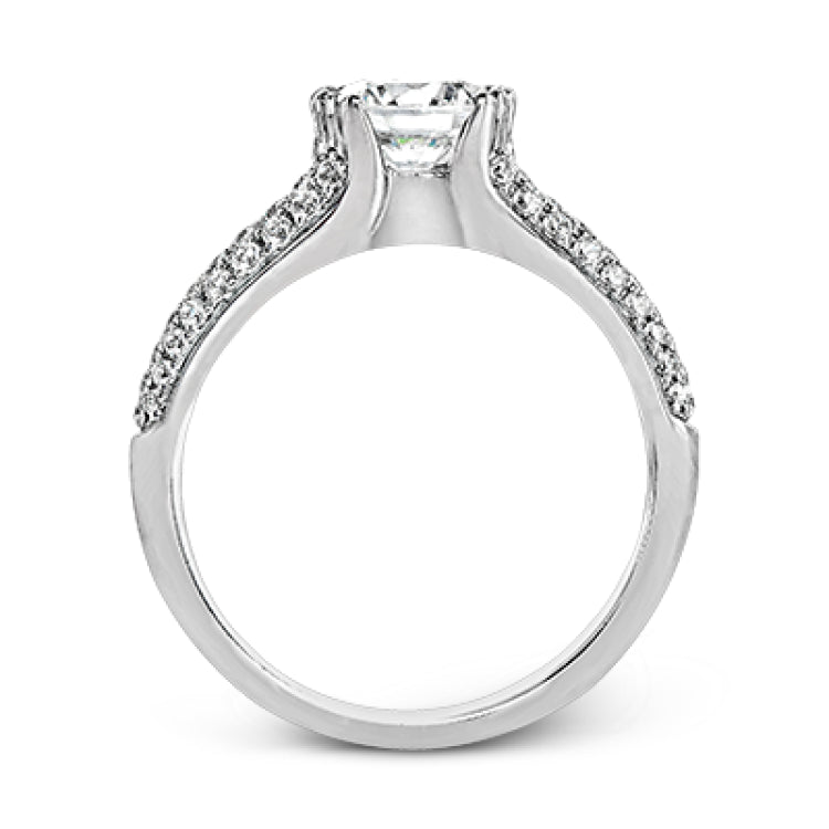 A modern take on a classic design, this white gold engagement ring is accented by .35 ctw of round cut white diamonds.
