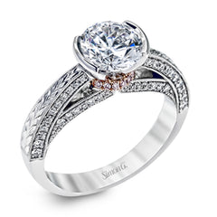 This exquisite white gold engagement ring is highlighted by .04 ctw of princess cut white diamonds and .34 ctw of round cut white diamonds.
