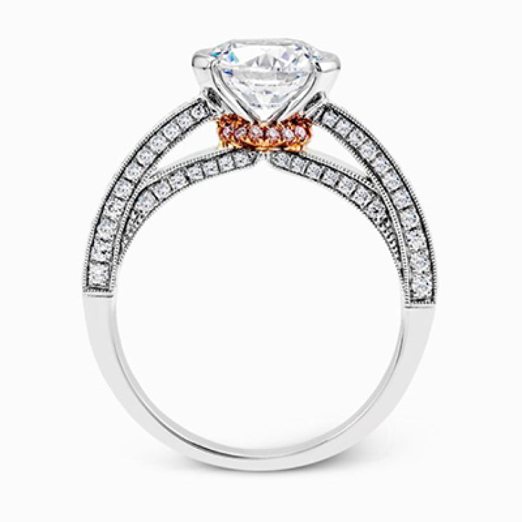 This exquisite white gold engagement ring is highlighted by .04 ctw of princess cut white diamonds and .34 ctw of round cut white diamonds.