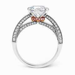 This exquisite white gold engagement ring is highlighted by .04 ctw of princess cut white diamonds and .34 ctw of round cut white diamonds.