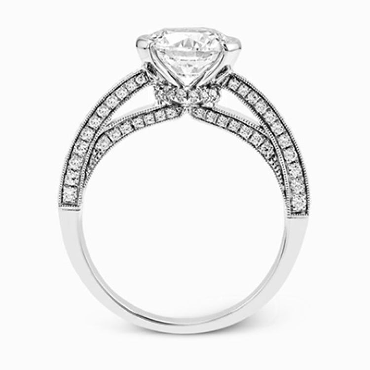 This exquisite white gold engagement ring is highlighted by .04 ctw of princess cut white diamonds and .34 ctw of round cut white diamonds.