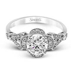 Accentuated with an impressive halo design, this contemporary white gold ring features .21 ctw round cut white diamonds.