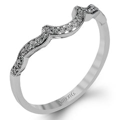 Accentuated with an impressive halo design, this contemporary white gold ring features .21 ctw round cut white diamonds.