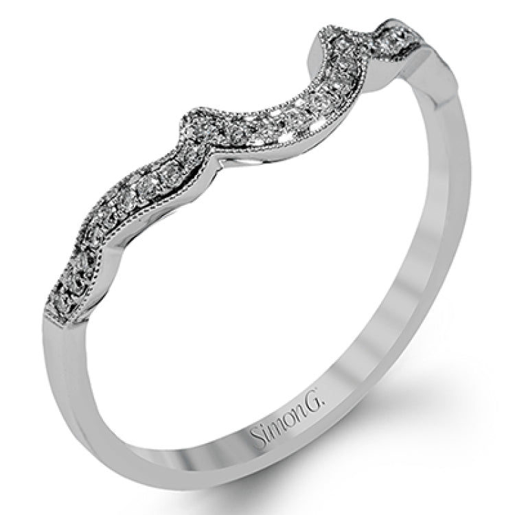 Accentuated with an impressive halo design, this contemporary white gold ring features .21 ctw round cut white diamonds.