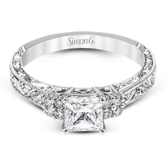 Featuring a dazzling vintage design, this romantic white gold engagement ring is highlighted by .15 ctw of striking white diamonds.