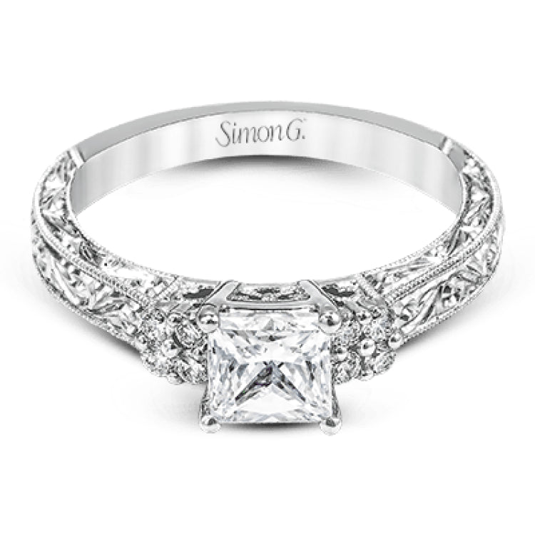Featuring a dazzling vintage design, this romantic white gold engagement ring is highlighted by .15 ctw of striking white diamonds.