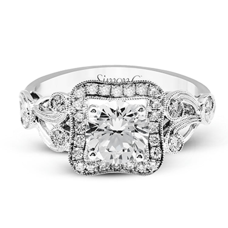 The lovely vintage design of this impressive white gold ring is emphasized by .27 ctw sparkling round cut white diamonds.