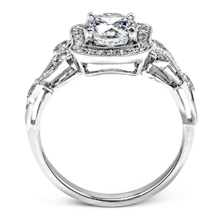The lovely vintage design of this impressive white gold ring is emphasized by .27 ctw sparkling round cut white diamonds.