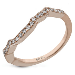 The lovely vintage design of this impressive white gold ring is emphasized by .27 ctw sparkling round cut white diamonds.