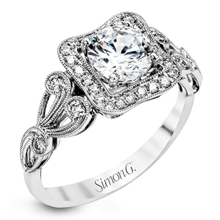 The lovely vintage design of this impressive white gold ring is emphasized by .27 ctw sparkling round cut white diamonds.