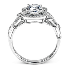 The lovely vintage design of this impressive white gold ring is emphasized by .27 ctw sparkling round cut white diamonds.