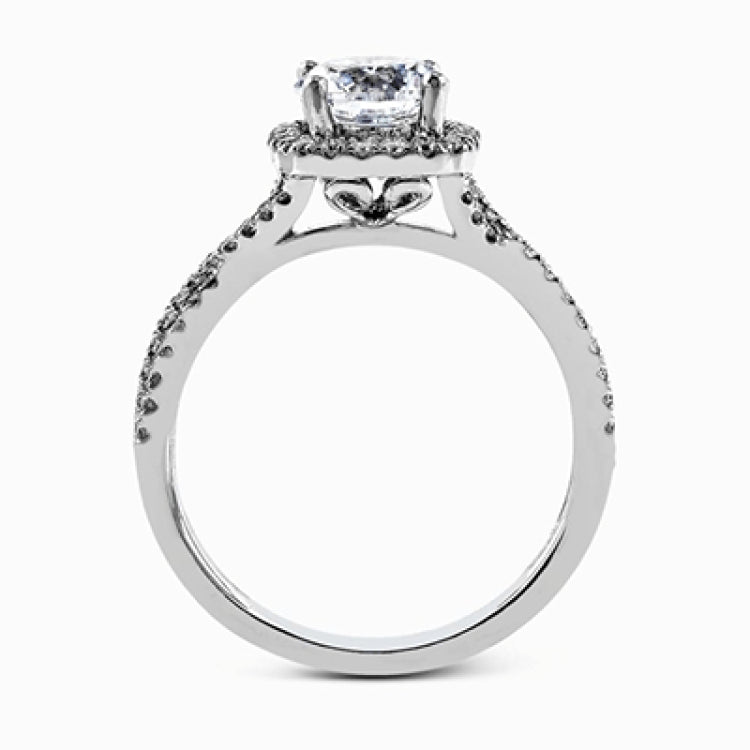 Presenting a lovely twisted shank design, this contemporary white gold engagement ring and wedding band set is accentuated with .44 ctw round cut white diamonds.