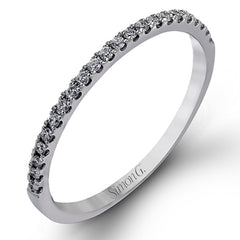 Presenting a lovely twisted shank design, this contemporary white gold engagement ring and wedding band set is accentuated with .44 ctw round cut white diamonds.