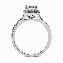 Presenting a lovely twisted shank design, this contemporary white gold engagement ring and wedding band set is accentuated with .44 ctw round cut white diamonds.
