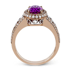 18KWR right hand ring with an intricate design along the shank has a diam halo .55 ctw, and an oval KNZT 5.89 ctw.