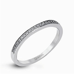 Showcasing a dazzling halo, this contemporary white gold wedding set is highlighted by .45 ctw of arresting round cut white diamonds.