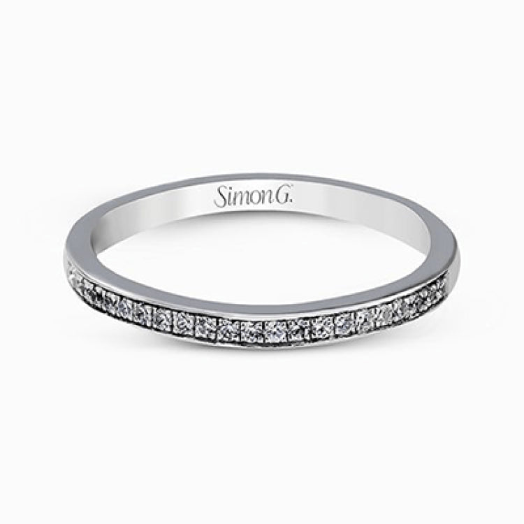 Showcasing a dazzling halo, this contemporary white gold wedding set is highlighted by .45 ctw of arresting round cut white diamonds.