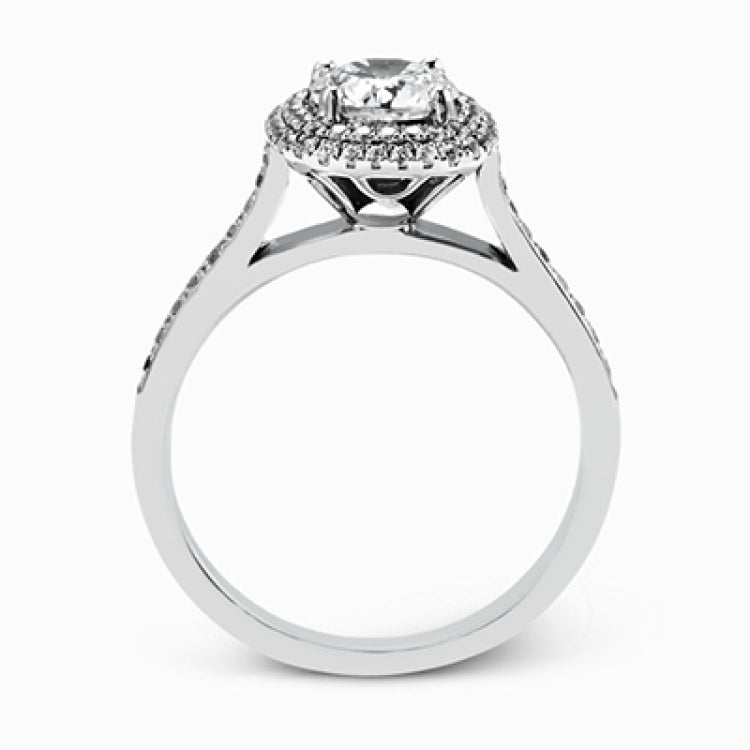Showcasing a dazzling halo, this contemporary white gold wedding set is highlighted by .45 ctw of arresting round cut white diamonds.