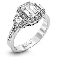 Featuring a lovely romantic setting, this white gold contemporary ring features an exquisite halo and .33 ctw of shimmering round cut white diamonds complemented by .34 ctw of trapezoid side diamonds.