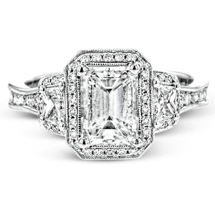 Featuring a lovely romantic setting, this white gold contemporary ring features an exquisite halo and .33 ctw of shimmering round cut white diamonds complemented by .34 ctw of trapezoid side diamonds.