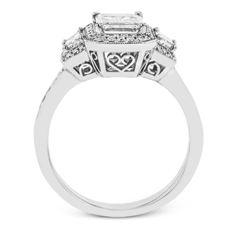 Featuring a lovely romantic setting, this white gold contemporary ring features an exquisite halo and .33 ctw of shimmering round cut white diamonds complemented by .34 ctw of trapezoid side diamonds.
