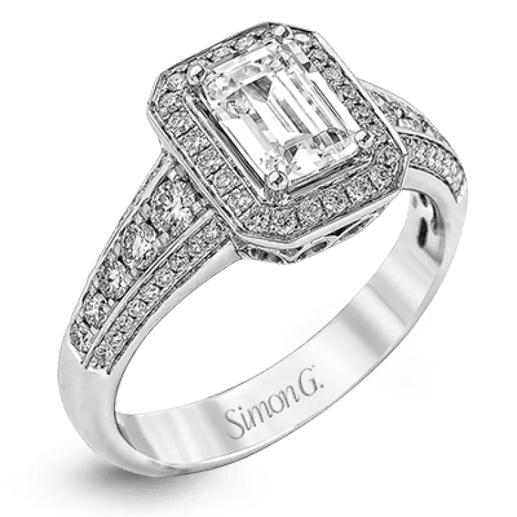 This romantic white gold engagement ring is complemented by .57 ctw of sparkling round cut white diamonds in a vintage-inspired setting.