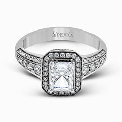 This romantic white gold engagement ring is complemented by .57 ctw of sparkling round cut white diamonds in a vintage-inspired setting.
