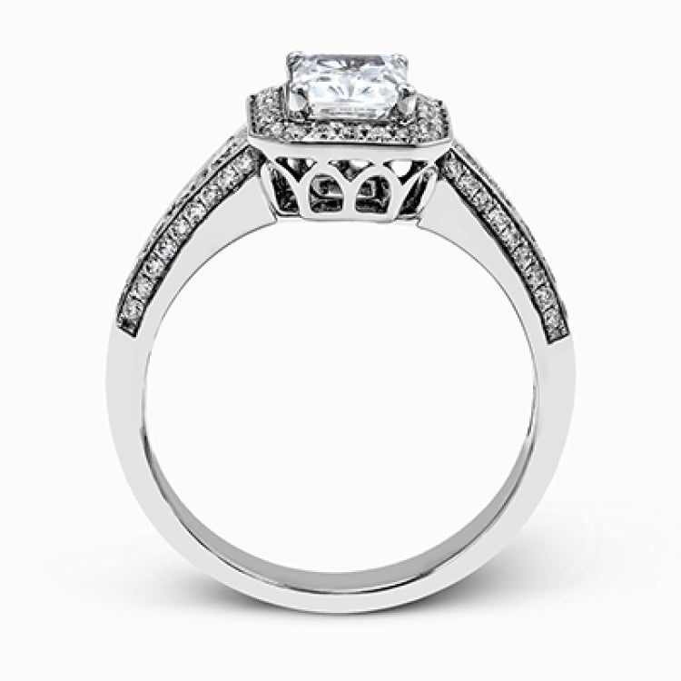 This romantic white gold engagement ring is complemented by .57 ctw of sparkling round cut white diamonds in a vintage-inspired setting.
