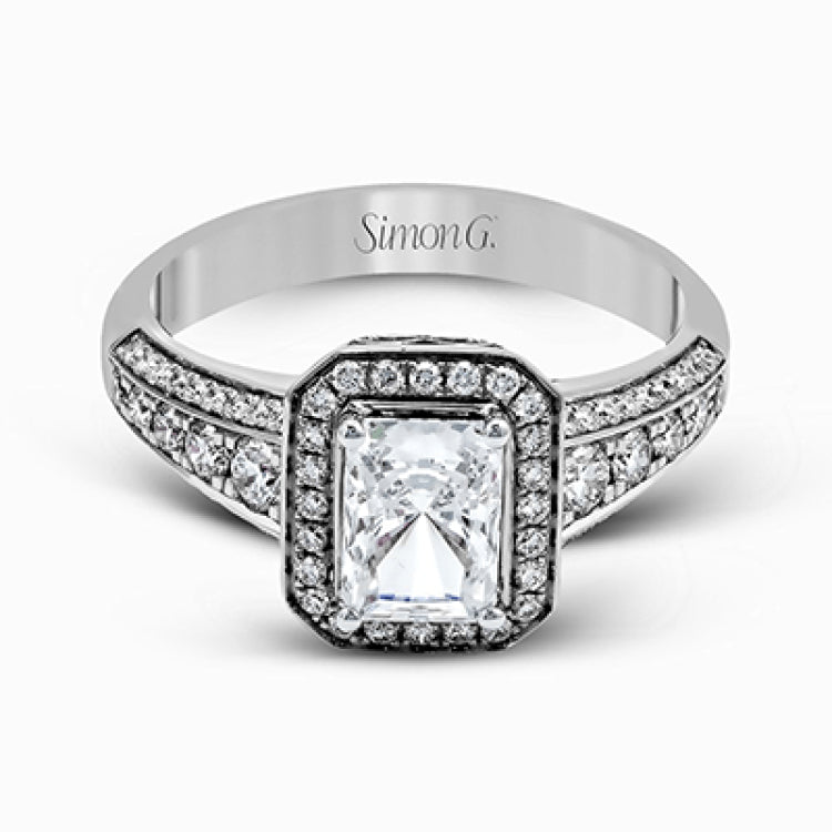 This romantic white gold engagement ring is complemented by .57 ctw of sparkling round cut white diamonds in a vintage-inspired setting.