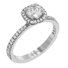 Accented by .46 ctw of glistening round cut white diamonds, this contemporary white gold halo style engagement ring and wedding band set makes a dramatic statement.