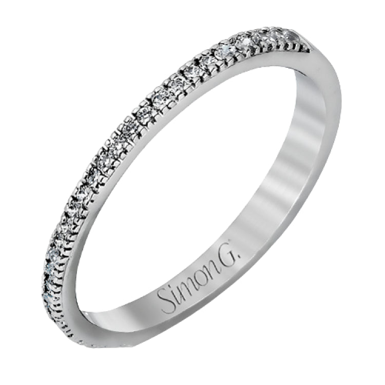 Accented by .46 ctw of glistening round cut white diamonds, this contemporary white gold halo style engagement ring and wedding band set makes a dramatic statement.