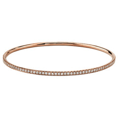 Presenting a charming classic style, this rose gold bangle bracelet is highlighted by .86 ctw of dazzling round white diamonds. Perfect for stacking.