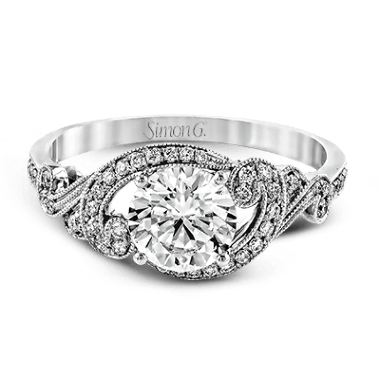 This lovely modern white gold engagement ring features a memorable halo and is accentuated by .19 ctw glistening round cut white diamonds.