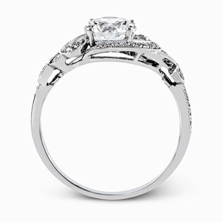 This lovely modern white gold engagement ring features a memorable halo and is accentuated by .19 ctw glistening round cut white diamonds.