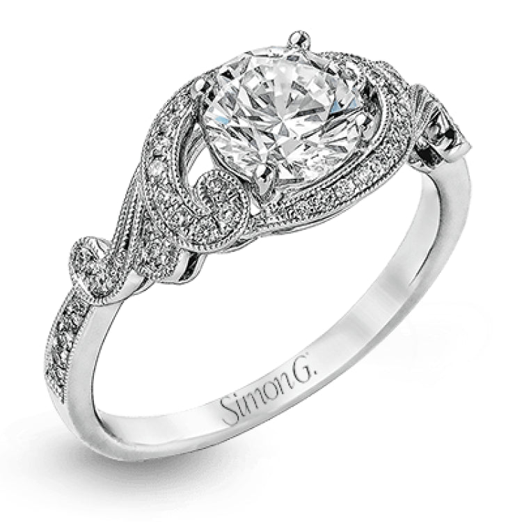 This lovely modern white gold engagement ring features a memorable halo and is accentuated by .19 ctw glistening round cut white diamonds.