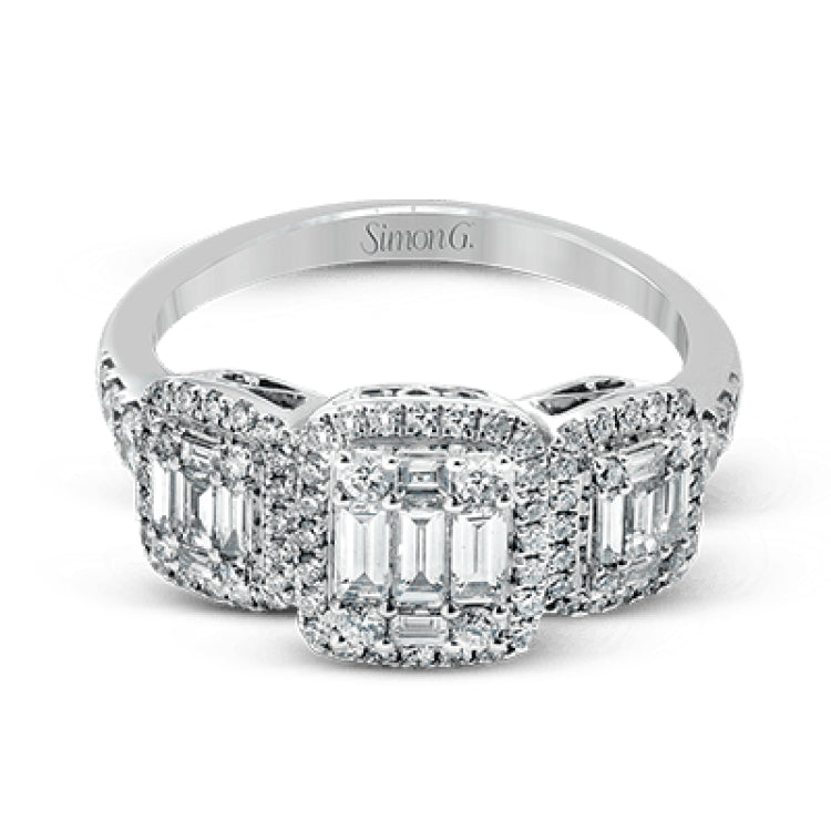 This amazing vintage-inspired ring features three halos and contains .52 ctw of round brilliant diamonds and .41 ctw of baguette diamonds.