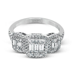 This amazing vintage-inspired ring features three halos and contains .52 ctw of round brilliant diamonds and .41 ctw of baguette diamonds.