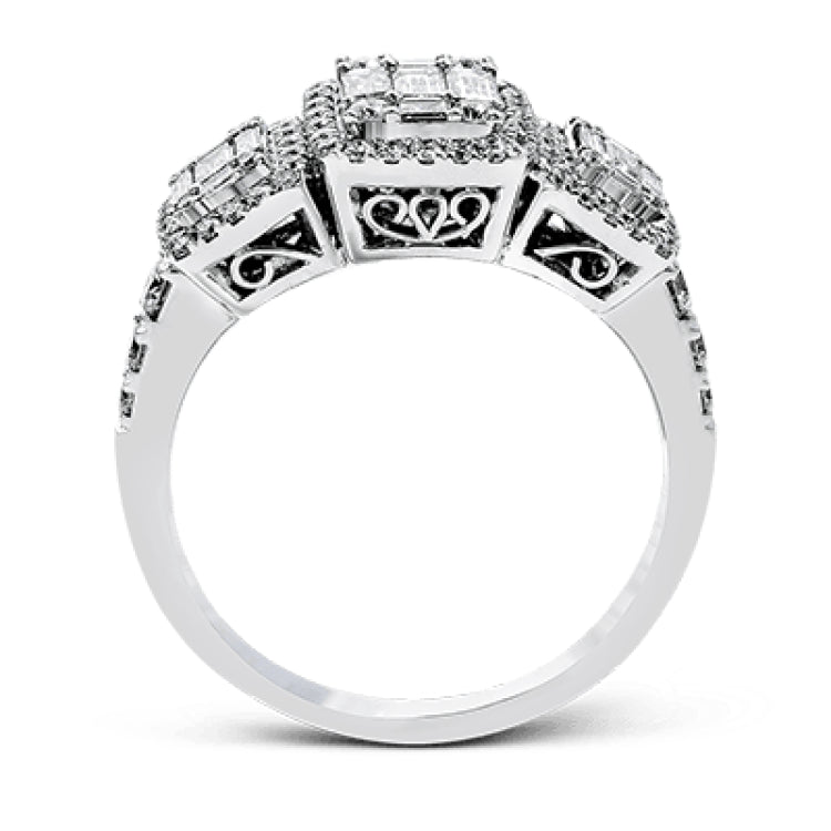 This amazing vintage-inspired ring features three halos and contains .52 ctw of round brilliant diamonds and .41 ctw of baguette diamonds.