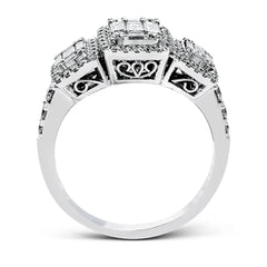 This amazing vintage-inspired ring features three halos and contains .52 ctw of round brilliant diamonds and .41 ctw of baguette diamonds.