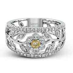 The delicate floral design of this white and yellow gold band is complemented by .53 ctw of round cut white diamonds and .04 ctw of round cut yellow diamond accents.
