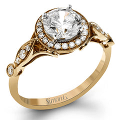 This sparkling white gold vintage inspired engagement ring features an exquisite halo and is set with .25 ctw round cut white diamonds.