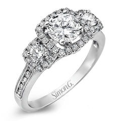 This dramatic contemporary white gold ring is accentuated by .37 ctw round cut white diamonds and features .30 ctw glimmering side stones.