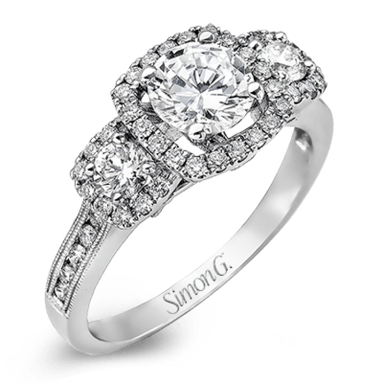 This dramatic contemporary white gold ring is accentuated by .37 ctw round cut white diamonds and features .30 ctw glimmering side stones.