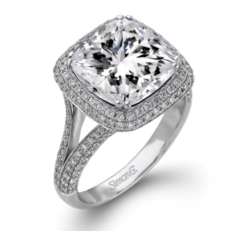 This eye-catching white gold ring is set with a remarkable 5.34 ctw sapphire accentuated by .68 ctw glistening round cut white diamonds.