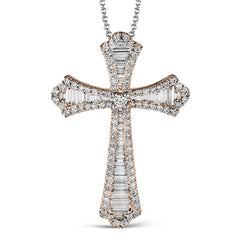 This striking white gold cross pendant is accented by the presence of .40 ctw round white diamonds and .56 ctw baguette cut diamonds.
