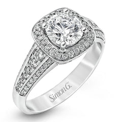 The classic design of this white gold engagement ring is emphasized by .44 ctw of dazzling round cut white diamonds.